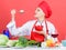 Dieting concept. Eat healthy. Healthy ration. Girl wear hat and apron try mushroom taste. Woman professional chef hold