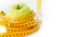 Dieting concept. Green apple with measuring tape. Green apples measured the meter, sports apple