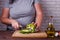Dieting, healthy food. Overweight woman slicing bell pepper, clo