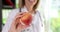 Dietitian doctor holds peach fruit in hand