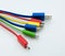 Diferent cables for computer and electronic devices on white background