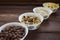 Differen cereal breakfast in white bowl on wooden table