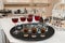 Different alcohol drinks on a tray. wine, champagne, cognac, vodka
