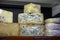 Different Asturian cheeses made from cow, goat and sheep melk on display in farmers cheese shop, Asturias, North Spain