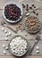 Different bean varieties. White, red and brown beans on plates on a wooden table.