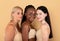 Different Beauty. Three Body Positive Females In Underwear Posing Over Beige Background