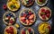 Different berry tarts on light table. Delicious pastries.