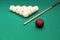 Different billiard balls and cue