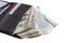 Different bills in a black leather purse, business concept. lot of money