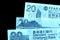 Different bills in twenty Hong Kong dollars. Money background blue color toned