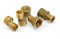 Different brass pipe fittings and plumbing components on white b
