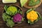 Different cabbages on wooden table, top view