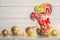 Different candies in glass jar for Christmas party on table.