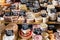 Different cheeses on the counter of a small store at the Aligre