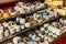 Different cheeses on the counter of a small store at the Aligre