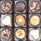 Different chocolate pralines. Box of belgian pralines of different shapes