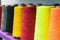 Different color spools of thread for the textile industry