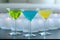 Different colored martinis with candles