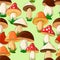 Different colored mushrooms in a cartoon style. Green seamless pattern. Vector