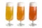 Different colors of foamy beer served in tulip pilsner glasses isolated on white background