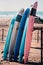 Different colors of surf on a the sandy beach in Casablanca - Morocco. Beautiful view on sandy beach and ocean. Surf boards for re