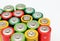 Different colours of batteries on white background. Close up of positive ends batteries, selective focus. Used battery for