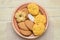 Different cookies in a clay plate