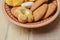 Different cookies in a clay plate