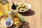 Different cooking oils and ingredients on wooden table, closeup. Space for text