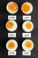 Different cooking time and readiness stages of boiled chicken eggs on table, flat lay