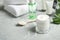 Different cosmetic products and aloe on grey marble table