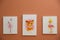 Different cute pictures on brown wall. Baby room interior
