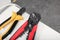 Different cutting pliers indoors, closeup. Electrician\\\'s tool