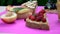 Different delicious toasts on green or pink crimson background. Healthy sandwich for breakfast or snack. Toast with