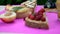 Different delicious toasts on green or pink crimson background. Healthy sandwich for breakfast or snack. Toast with