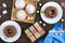 Different desserts on a wooden background. Chocolate pudding, muffins with icing sugar, Turkish delight.