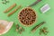 Different dog food and snack, chicken filet, antlers, lung, ear on green background
