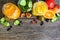 Different drinks, fruits and vegetables on wooden background.