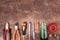 Different electrical tools on light brown background