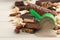 Different energy bars, nuts and protein powder on white wooden table, closeup