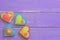 Different felt hearts. Valentine background with sewed felt hearts on wooden planks. Happy Valentines card. Wooden background