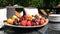 Different fresh berries and fruits make dish on large plate