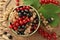 Different fresh ripe currants and green leaves on table, top view