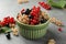 Different fresh ripe currants on light grey table, closeup