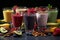 Different fruit smoothies on a table with a variety of fruits