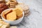 Different gluten free products on light grey textured table, closeup. Space for text