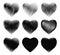 Different grunge dirty shapes of black heart on white background collection.