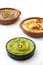 Different hummus bowls. Chickpea hummus, avocado hummus and lentils hummus