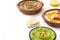 Different hummus bowls. Chickpea hummus, avocado hummus and lentils hummus isolated