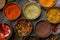 Different Indian spices top view on blue wooden table